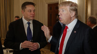 resident Donald Trump talks with Tesla and SpaceX CEO Elon Musk, center, and White House chief strategist Steve Bannon during a meeting with business leaders in the State Dining Room of the White House in Washington, Friday, Feb. 3, 2017. (