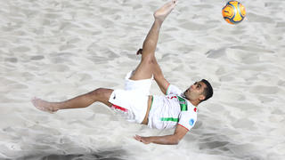 DUBAI, UNITED ARAB EMIRATES - NOVEMBER 01: Mohammad Masoumizadeh of Iran takes a shot at goal during the Emirates Intercontinental Beach Soccer Cup 2022 group match between Iran  and Paraguay  at Kite Beach on November 01, 2022 in Dubai, United Arab Emirates. (Photo by Francois Nel/Getty Images)