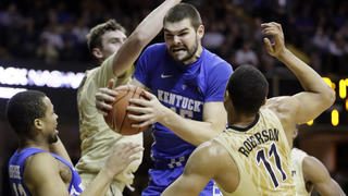 FILE - Kentucky forward Isaac Humphries, center, grabs a rebound in front of Vanderbilt's Luke Kornet, second from left, and Jeff Roberson (11) during the first half of an NCAA college basketball game on Jan. 10, 2017, in Nashville, Tenn. Melbourne United starting center Isaac Humphries has announced that he is gay and said he hopes his decision to publicly announce his sexuality will lead to more professional sportsmen doing the same. (AP Photo/Mark Humphrey, File)