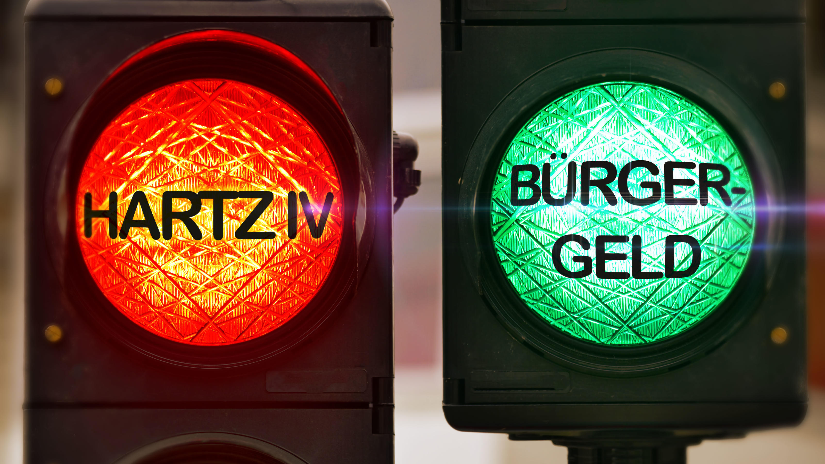 Rote und grüne Ampel mit Aufschrift Bürgergeld und Hartz IV / action press