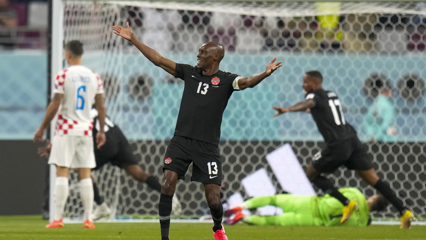 Canada's Atiba Hutchinson celebrates after Canada's Alphonso Davies scored his side's opening goal during the World Cup group F soccer match between Croatia and Canada, at the Khalifa International Stadium in Doha, Qatar, Sunday, Nov. 27, 2022. (AP P
