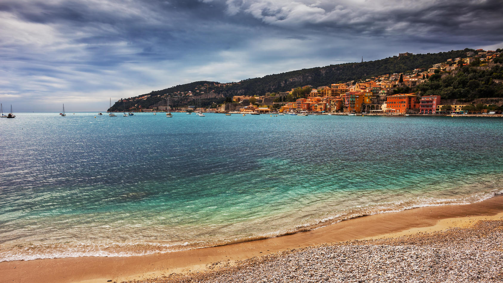 Beach and sea bay in Villefranche-sur-Mer resort on French Riviera in France