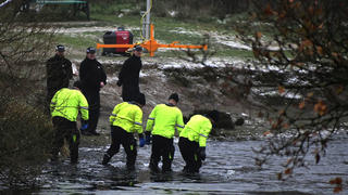 Police search teams at the scene after children fell through ice,in Babbs Mill Park in Kingshurst, Solihull, England, Monday, Dec. 12, 2022. Three young boys who fell through ice covering a lake in central England have died and a fourth remains hospitalized as weather forecasters issued severe weather warnings for large parts of the United Kingdom. Rescuers pulled the boys, aged 8, 10 and 11, from the icy waters Sunday afternoon and rushed them to the hospital in the West Midlands, about 100 miles (160 kilometers) north of London. But they could not be revived after suffering cardiac arrest. (Matthew Cooper/PA via AP)