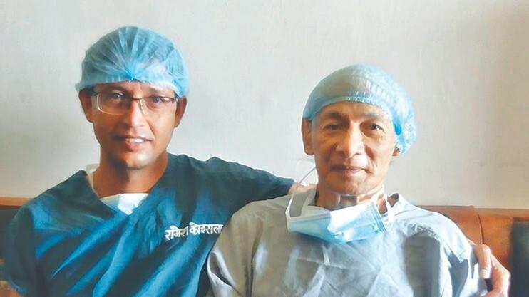 Heart surgeon Dr Raamesh Koirala (right) is seen with Charles Sobhraj, a notorious French serial killer, ahead of an operation at Shahid Gangalal National Heart Center, Kathmandu on Monday.