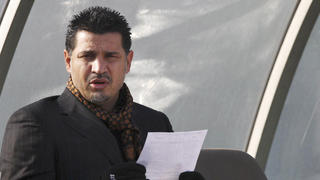 FILE - Former Iran's national soccer team coach Ali Daei before an Asian Cup 2011 qualifying soccer match between Iran and Singapore in Tehran, Iran, Jan, 14, 2009. Daei has expressed support for anti-government protests, saying that his wife and daughter were prevented from leaving the country on Monday, Dec. 26, 2022, after their plane made an unannounced stopover en route to Dubai. (AP Photo/Hasan Sarbakhshian, File)