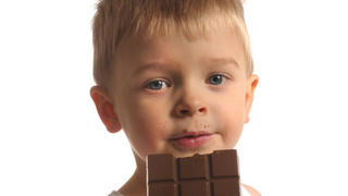 Picture of a little blond boy in white top eating chocolate (CTK Photo/Vojtech Vlk) MODEL RELEASED, MR