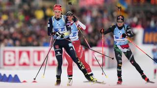Denise Herrmann-Wick of Germany, from left, Lena Haecki-Gross of Switzerland and Dorothea Wierer of Italy arrive the shooting ranch during the women's 4x6km relay competition at the Biathlon World Cup race in Ruhpolding, Germany, Saturday, Jan. 14, 2023. (AP Photo/Matthias Schrader)