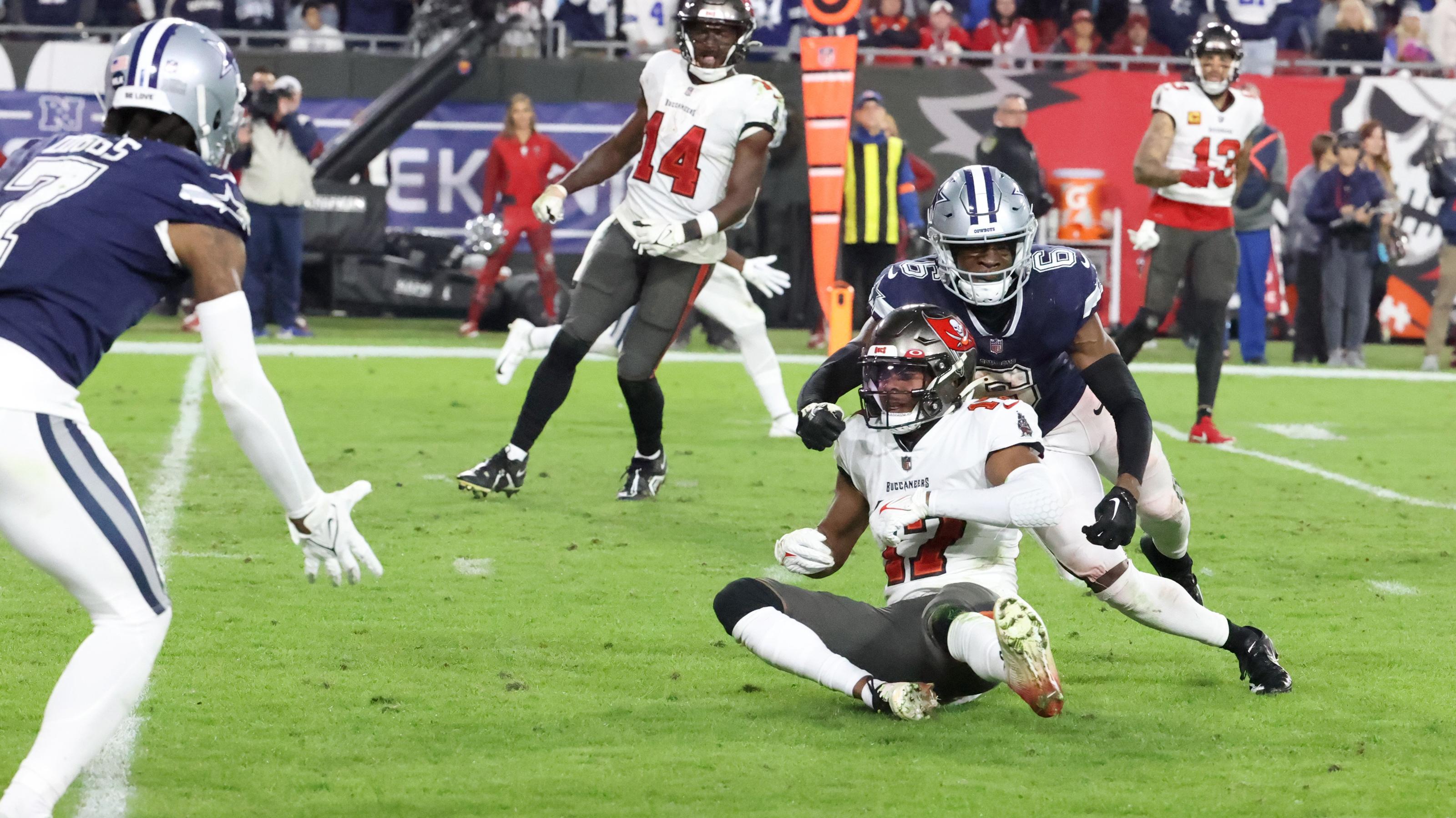 January 16, 2023, Tampa, Florida, USA: Tampa Bay Buccaneers wide receiver Russell Gage (17) is injured on a broken pass play with Dallas Cowboys safety Donovan Wilson (6) defending during the fourth quarter of the NFL Wild Card game between the Tampa