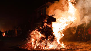 January 16, 2023, San Bartolome de Pinares, Spain: A horseman rides through a bonfire made with pine tree branches in the village of San Bartolome de Pinares during the traditional religious festival of Las Luminarias in honour of San Antonio Abad Saint Anthony, patron saint of animals celebrated every night of January 16. The riders take part in a procession with their horses and donkeys, crossing the multiple bonfires lit on the streets of the City. San Bartolome de Pinares Spain - ZUMAs197 20230116_zaa_s197_301 Copyright: xGuillermoxGutierrezx
