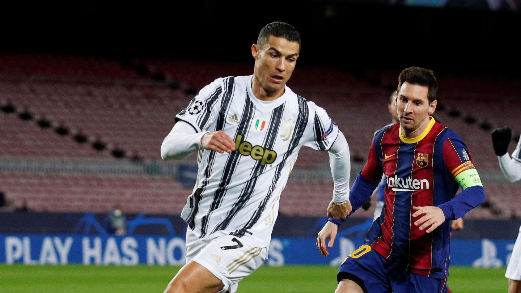 FILE PHOTO: Soccer Football - Champions League - Group G - FC Barcelona v Juventus - Camp Nou, Barcelona, Spain - December 8, 2020 FC Barcelona's Lionel Messi in action with Juventus' Cristiano Ronaldo REUTERS/Albert Gea/File Photo