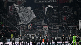 FREIBURG IM BREISGAU, GERMANY - JANUARY 25: Eintracht Frankfurt fans applaud the fans after the draw during the Bundesliga match between Sport-Club Freiburg and Eintracht Frankfurt at Europa-Park Stadion on January 25, 2023 in Freiburg im Breisgau, Germany. (Photo by Christian Kaspar-Bartke/Getty Images)