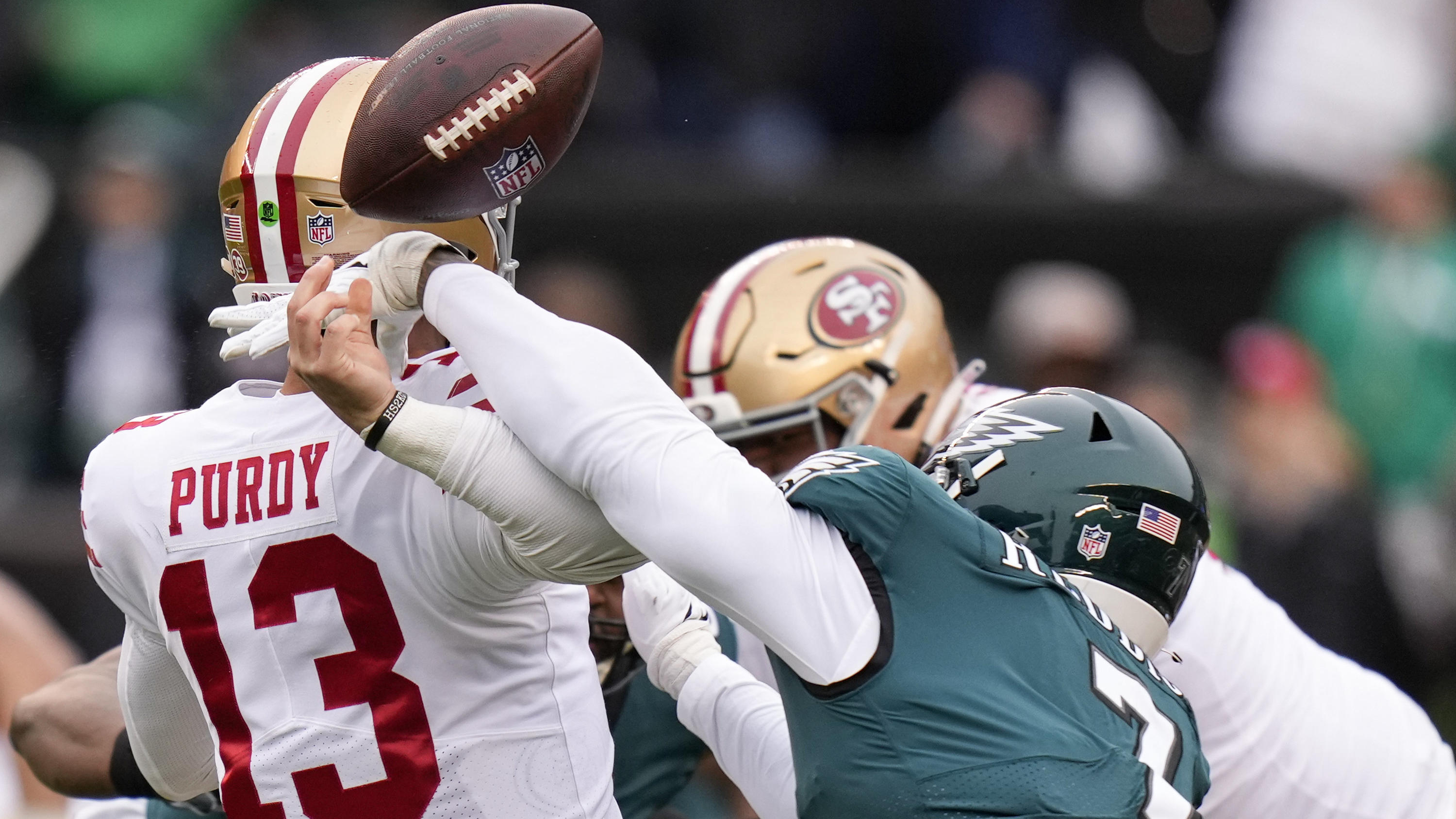 Philadelphia Eagles linebacker Haason Reddick, right, causes a fumble by San Francisco 49ers quarterback Brock Purdy during the first half of the NFC Championship NFL football game between the Philadelphia Eagles and the San Francisco 49ers on Sunday