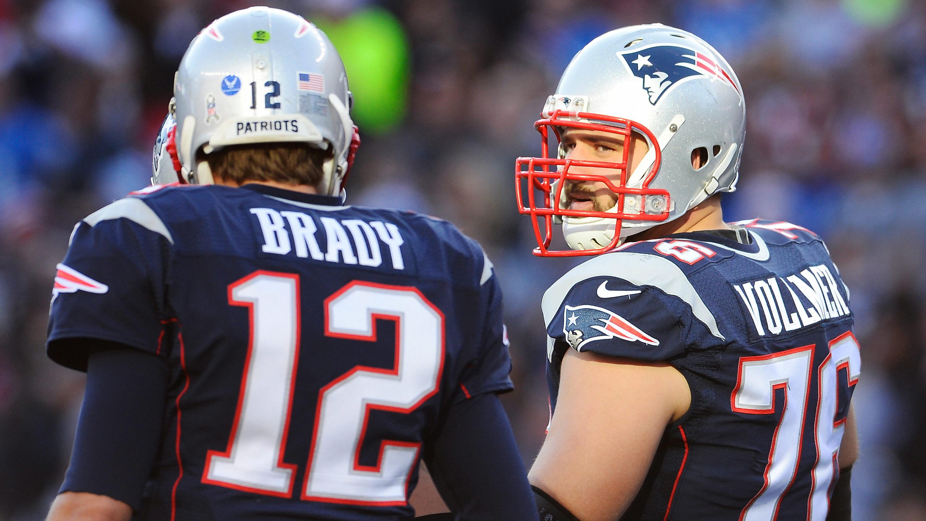 (File) New England Patriots tackle Sebastian Vollmer of Germany (R) talks with New England Patriots quarterback Tom Brady (L) before a play during the first half of the NFL American football game between the Detroit Lions and the New England Patriots