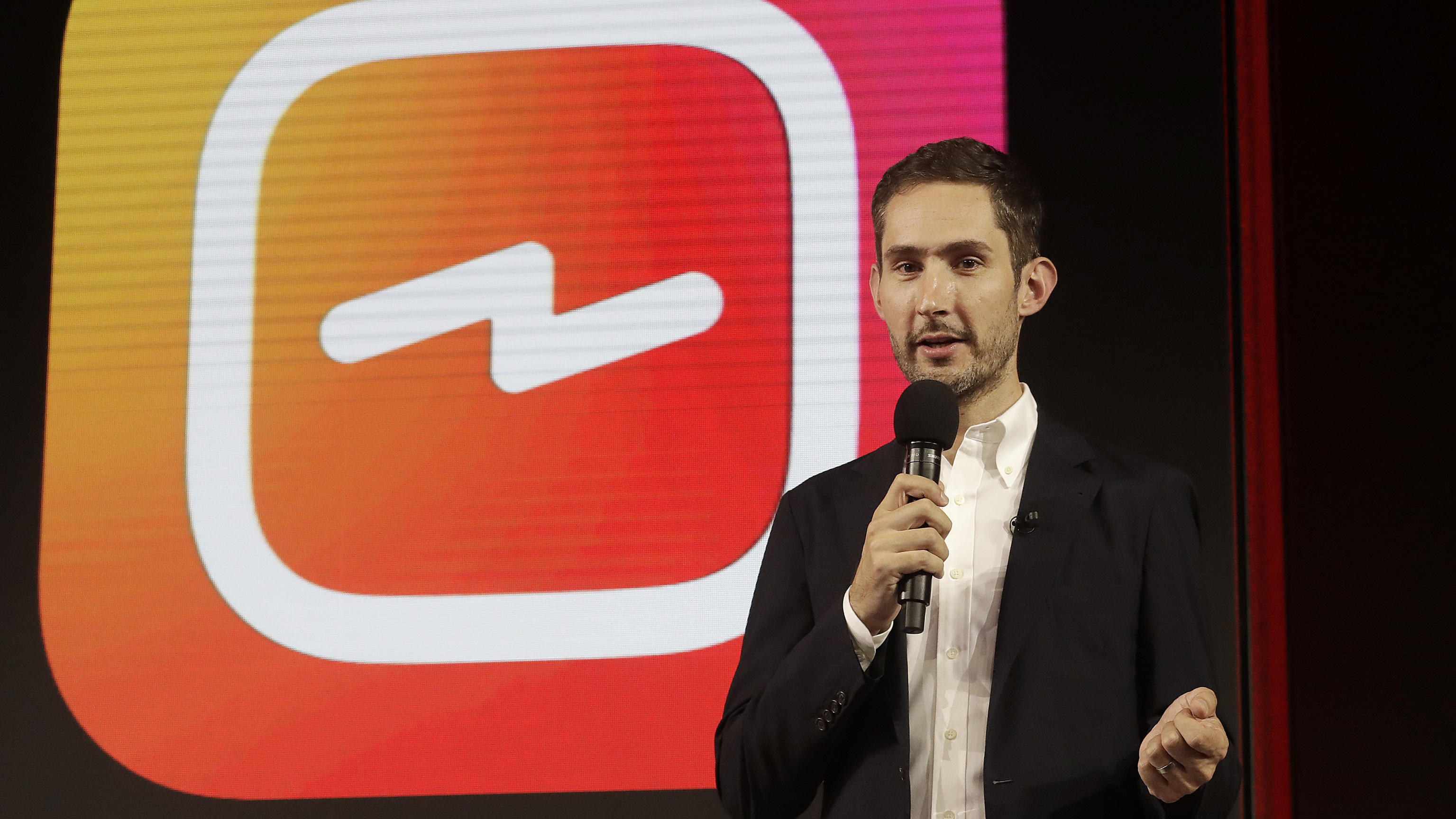 In this Tuesday, June 19, 2018, file photo, Kevin Systrom, CEO and co-founder of Instagram, prepares for an announcement about IGTV in San Francisco. In a statement late Monday, Sept. 24, 2018, Systrom said in a statement that he and Mike Krieger, In