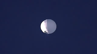 ADDS PENTAGON RESPONSE THAT IT WOULD NOT CONFIRM - A high altitude balloon floats over Billings, Mont., on Wednesday, Feb. 1, 2023. The U.S. is tracking a suspected Chinese surveillance balloon that has been spotted over U.S. airspace for a couple days, but the Pentagon decided not to shoot it down due to risks of harm for people on the ground, officials said Thursday, Feb. 2, 2023. The Pentagon would not confirm that the balloon in the photo was the surveillance balloon. (Larry Mayer/The Billings Gazette via AP)