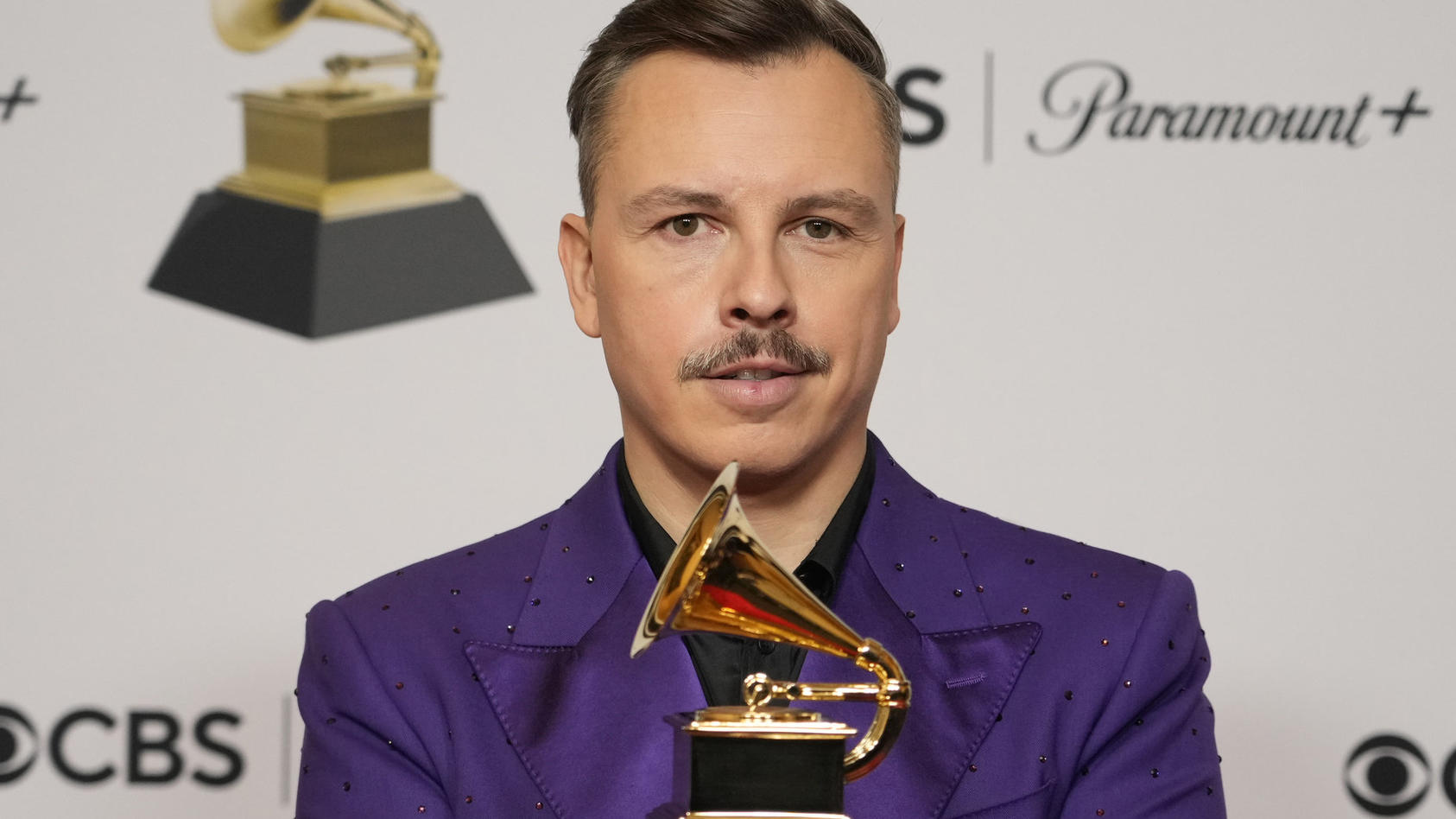 Purple Disco Machine poses in the press room with the award for best remixed recording for "About Damn Time (Purple Disco Machine Remix)" at the 65th annual Grammy Awards on Sunday, Feb. 5, 2023, in Los Angeles. (AP Photo/Jae C. Hong)