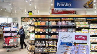 People make his purchases at the Nestle's own supermarket after the 2019 full-year results press conference of the food and drinks giant Nestle, in Vevey, Switzerland, Thursday, February 13, 2020.