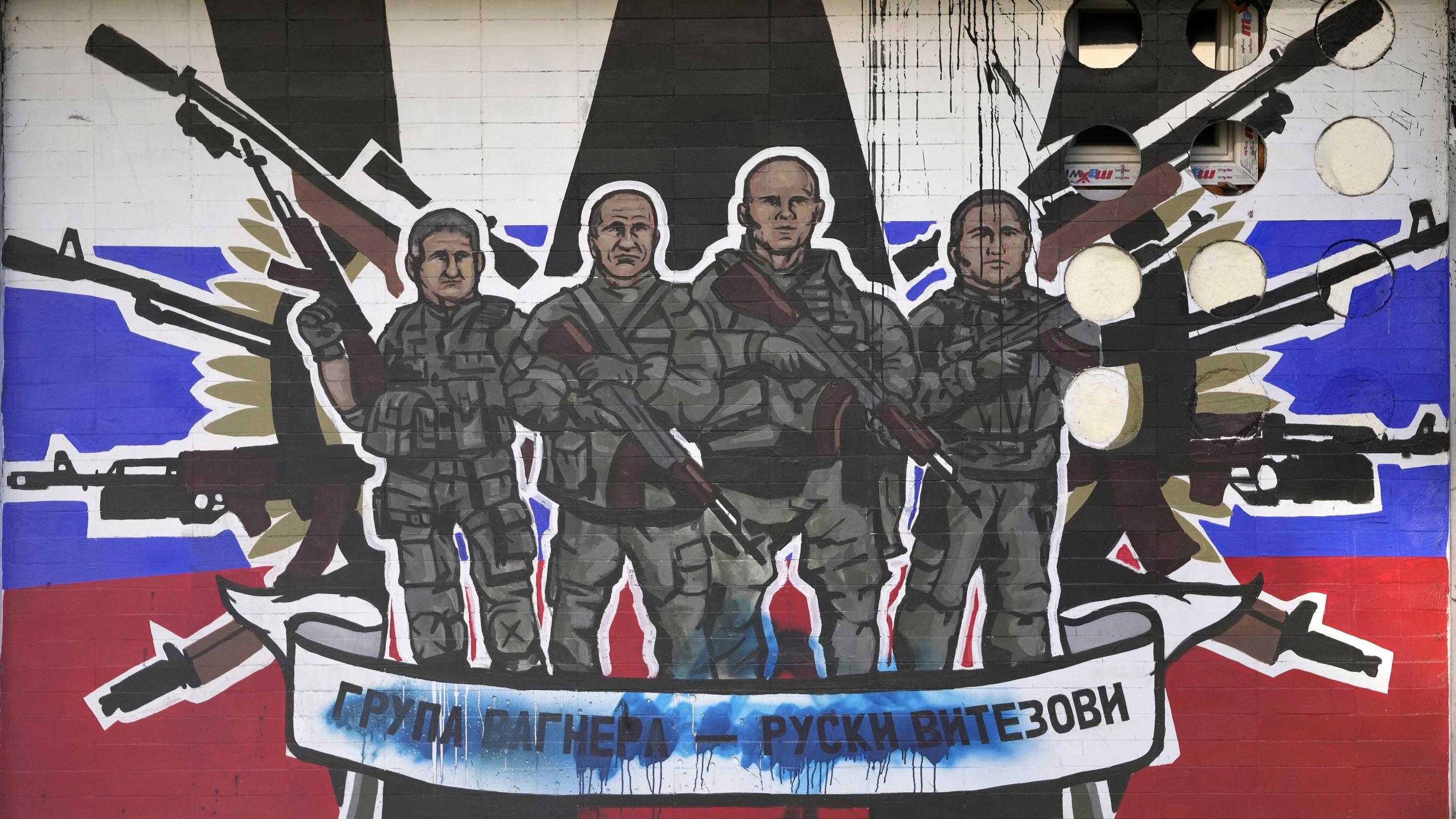 FILE - A mural depicting mercenaries of Russia's Wagner Group that reads: "Wagner Group - Russian knights" vandalized with paint on a wall in Belgrade, Serbia, on Jan. 13, 2023. Russia's Wagner Group, a private military company led by Yevgeny Prigozh