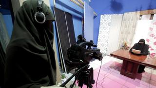 A video woman records a program in a studio of a new TV channel which is being managed and run exclusively by women who wear the full veil, to be launched this weekend, in Cairo July 19, 2012. In an age of new freedoms in the post-Hosni Mubarak Egypt, niqab-wearing women long oppressed socially and politically are hoping for a new place in society. Though Egypt is a deeply conservative and predominantly Muslim society, niqab wearers have cited discrimination in the job market, education and elsewhere. A new TV channel being managed and run exclusively by women who wear the full veil, to be launched this weekend on the first day of the Islamic fasting month of Ramadan, hopes to let people know "that there are successful women wearing niqab".  REUTER/Mohamed Abd El Ghany (EGYPT - Tags: MEDIA BUSINESS EMPLOYMENT RELIGION SOCIETY)