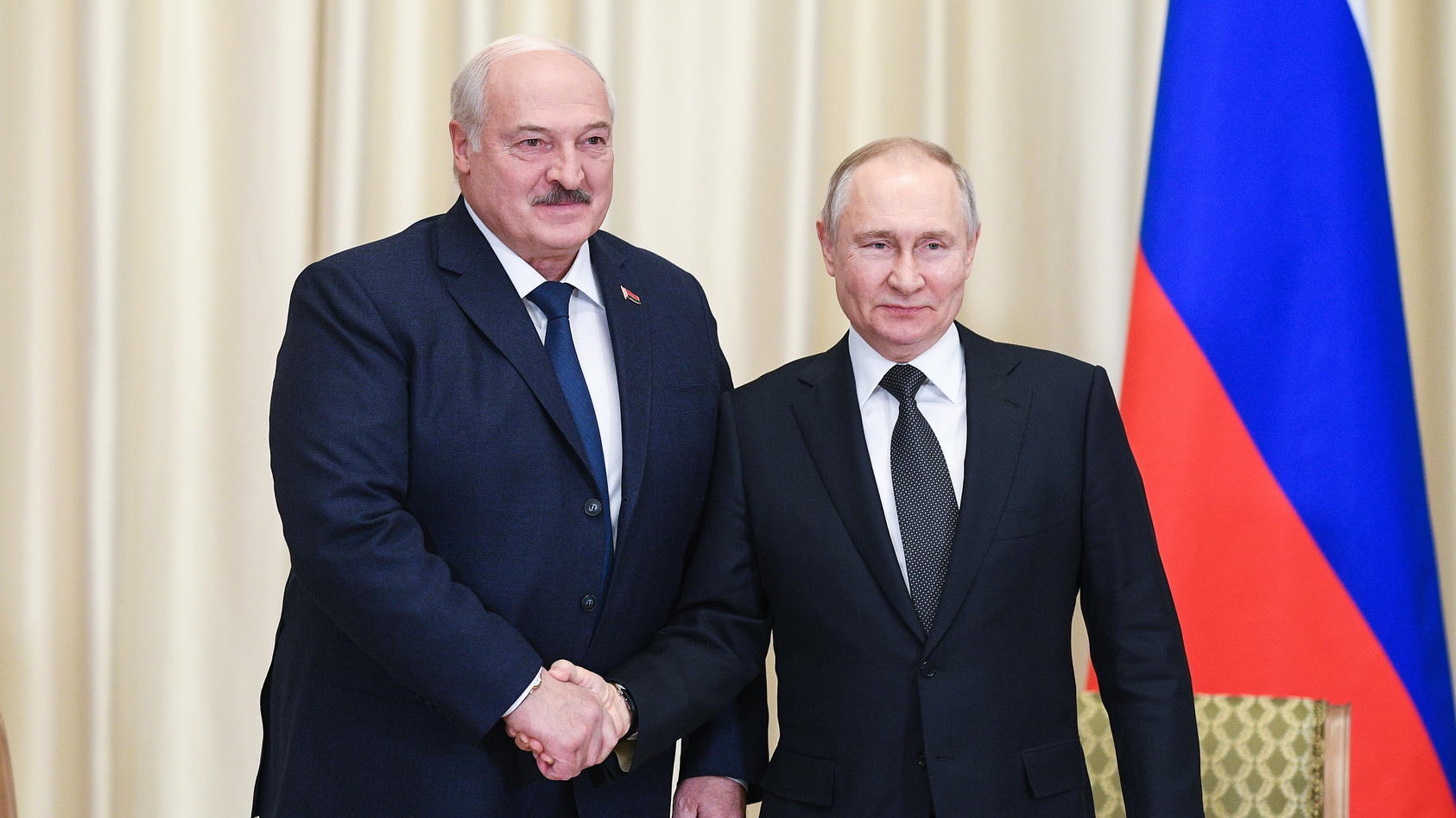 RUSSIA, NOVO-OGARYOVO - FEBRUARY 17, 2023: Belarusian President Alexander Lukashenko (L) and Russia's President Vladimir Putin shake hands as they pose for a photograph during a meeting in the Novo-Ogaryovo residence. Vladimir Astapkovich/POOL/TASS /