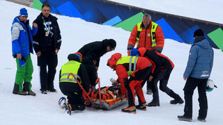 Nordic Skiing - FIS Nordic World Ski Championships - Planica, Slovenia - March 1, 2023 Slovenia's Peter Prevc is taken on a stretchered after sustaining an injury during training REUTERS/Borut Zivulovic