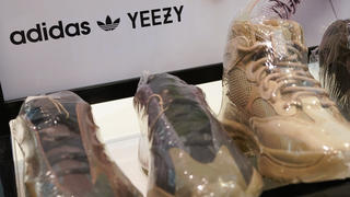 A sign advertises Yeezy shoes made by Adidas at Kickclusive, a sneaker resale store, in Paramus, N.J., Tuesday, Oct. 25, 2022. Adidas has ended its partnership with the rapper formerly known as Kanye West over his offensive and antisemitic remarks, t
