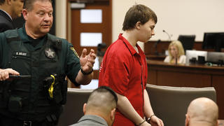 Aiden Fucci is led into the courtroom start his sentencing hearing, Friday, March 24, 2023. in St. Augustine, Fla. A Florida judge sentenced the 16-year-old Florida boy to life in prison on Friday for fatally stabbing a 13-year-old classmate on Mother's Day in 2021. Fucci, who pleaded guilty just before his trial was set to start in February, was not eligible for the death penalty. (Bob Self/The Florida Times-Union via AP)