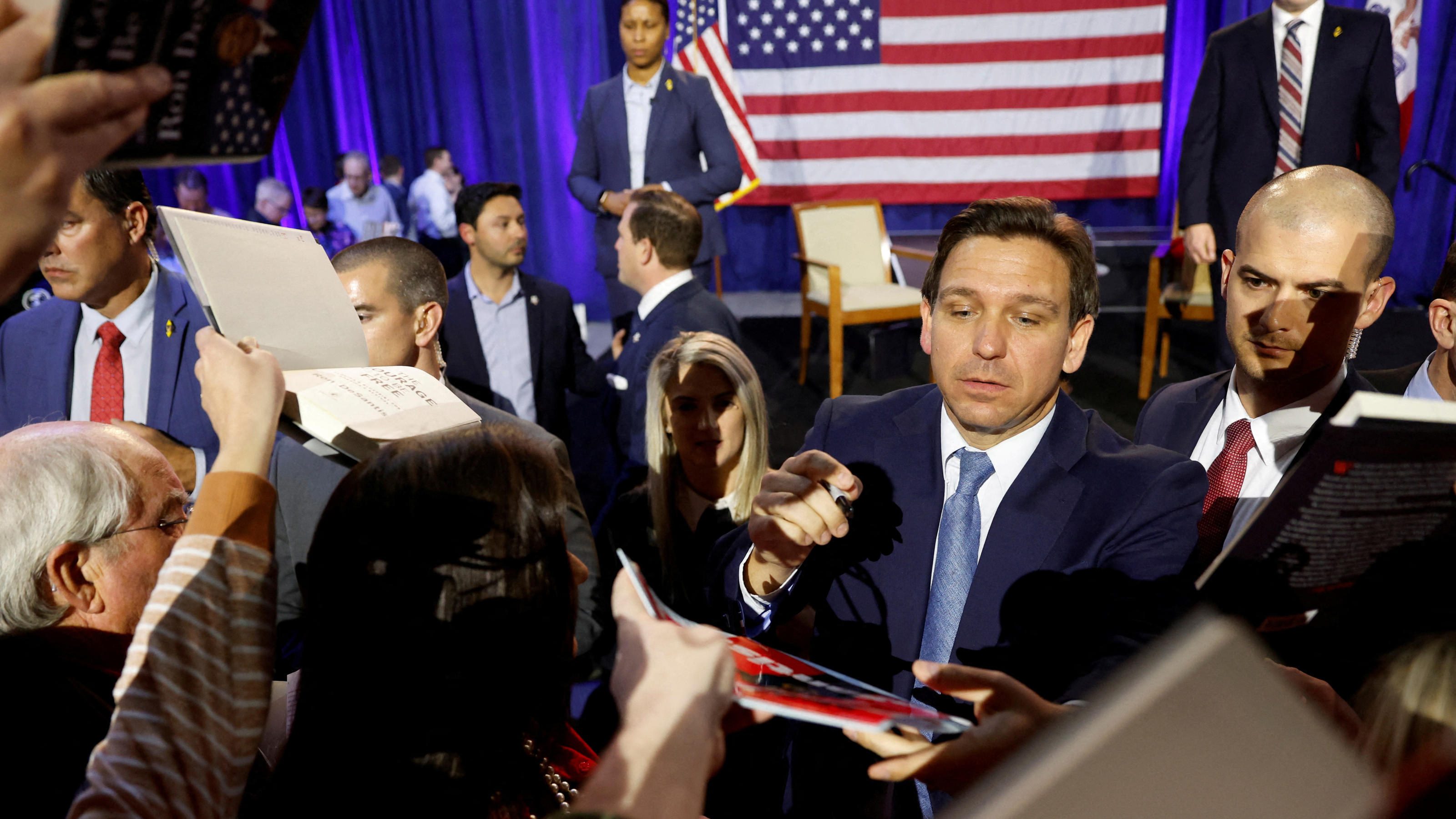 FILE PHOTO: Florida Governor Ron DeSantis greets attendees and signs books after his remarks as he makes his first trip to the early voting state of Iowa for a book tour stop at the Iowa State Fairgrounds in Des Moines, Iowa, U.S. March 10, 2023. REU