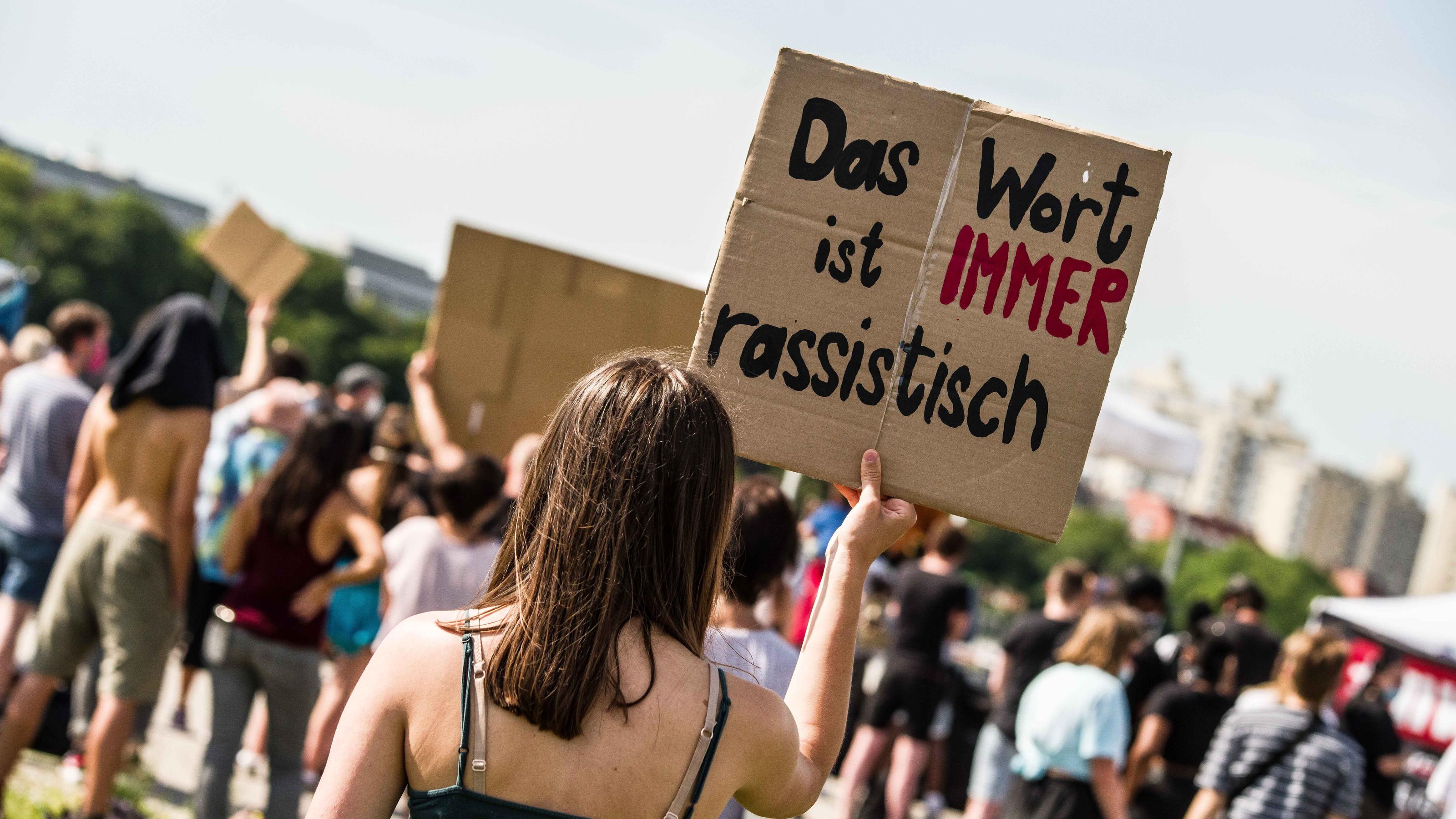 June 27, 2020, Munich, Bavaria, Germany: ''The word is always racist'' held by a demonstrator against the ongoing use of the N-word in Germany. In the wake of the killing of George Floyd and numerous other cases of police brutality and killings again