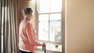 When did the days become so grey. Shot of a senior woman with a cane looking thoughtfully out of a window at home. Shot of a senior woman with a cane looking thoughtfully out of a window at home. Copyright: xZoonar.com/YurixArcursxpeopleimages.comx 18546264 ,model released, Symbolfoto ,property released