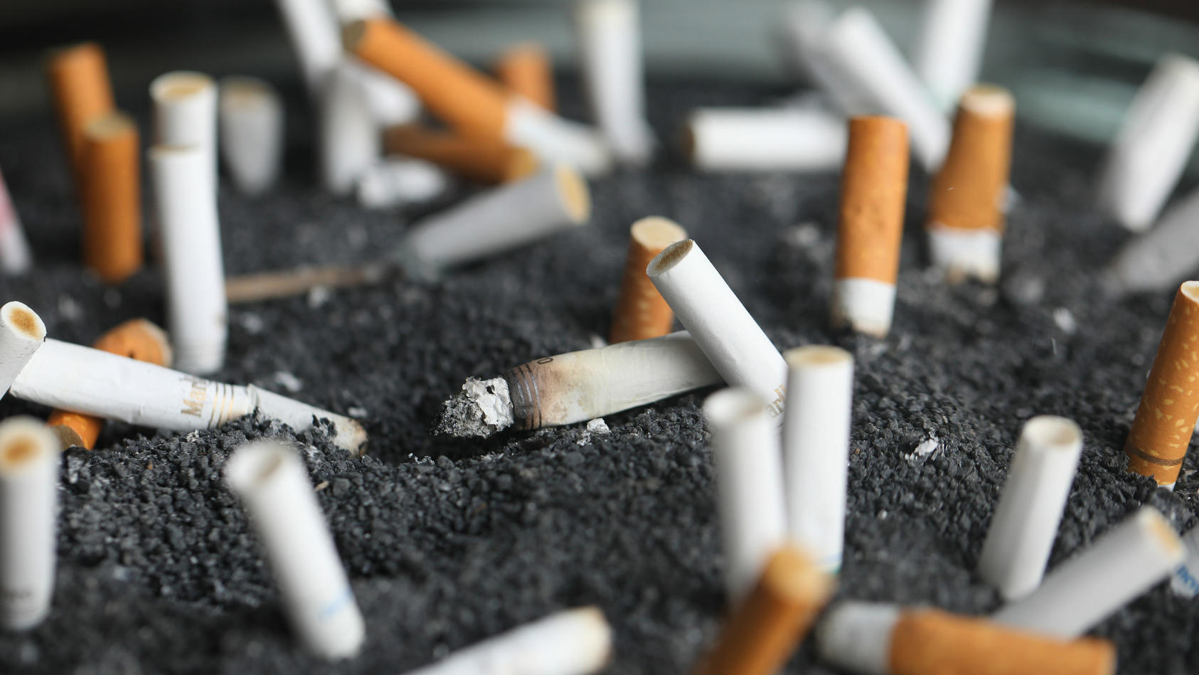 FILE - Cigarette butts sit in an ashtray on March 28, 2019, in New York. The highest court in Massachusetts has upheld a nearly $37 million judgment for a woman Tuesday, May 9, 2023, who said she developed cancer after switching to Marlboro Light cig