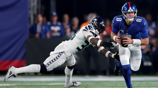 Oct 2, 2023; East Rutherford, New Jersey, USA; New York Giants quarterback Daniel Jones (8) runs with the ball against Seattle Seahawks safety Jamal Adams (33) during the first quarter at MetLife Stadium. Mandatory Credit: Brad Penner-USA TODAY Sports