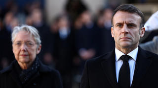 French President Emmanuel Macron and French Prime Minister Elisabeth Borne review troops during a national tribute ceremony for late French politician and former European Commission President Jacques Delors in the courtyard of the Hotel des Invalides in Paris, France, January 5, 2024. REUTERS/Stephanie Lecocq/Pool