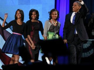 U.S. President Barack Obama greets supporters on stage with first lady Michelle Obama and daughters Malia (L) and Sasha during his election night rally in Chicago, November 7, 2012. REUTERS/Jason Reed (UNITED STATES  - Tags: POLITICS ELECTIONS USA PRESIDENTIAL ELECTION)  