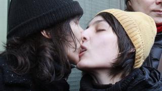 Women share a kiss during a protest near the Duma, Russia's lower house of Parliament, in Moscow January 25, 2013. Russia's parliament is due to hold its first reading on a "homosexual propaganda" law on Friday, which was earlier postponed. Russian lawmakers may adopt the bill that bans promotion of homosexual, lesbian, bisexual, and transgender practices among minors and imposes large administrative fines for spreading propaganda of this kind during concerts in particular, according to local media. REUTERS/Sergei Karpukhin (RUSSIA - Tags: POLITICS CIVIL UNREST SOCIETY CRIME LAW)
