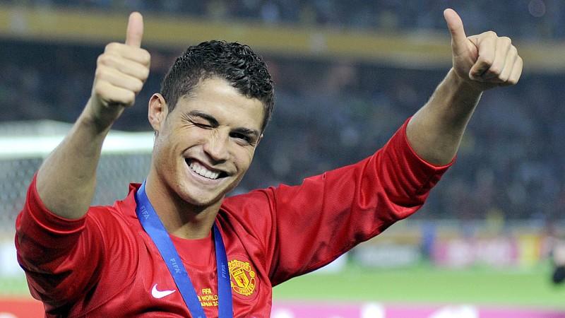 Manchester United's European Footballer of the Year Cristiano Ronaldo from Portugal winks to fans celebrating his team's win against Ecuador's Liga de Quito at the FIFA Club World Cup soccer final match in Yokohama, south of Tokyo, Japan, 21 December