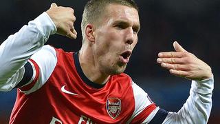 Arsenal's Lukas Podolski celebrates scoring against Montpellier during their Champions League Group B soccer match at Emirates Stadium in London November 21, 2012. REUTERS/Toby Melville (BRITAIN - Tags: SPORT SOCCER)