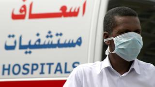 A man, wearing a surgical mask as a precautionary measure against the novel coronavirus, walks near a hospital in Khobar city in Dammam May 21, 2013. Saudi Arabia has reported another case of infection in a concentrated outbreak of a new strain of a virus that emerged in the Middle East last year and spread into Europe, the World Health Organization (WHO) said on May 18, 2013. In a disease outbreak update issued from its Geneva headquarters, the WHO said the latest patient is an 81-year-old woman with multiple medical conditions. She became ill on April 28 and is in a critical but stable condition. Worldwide, there have now been 41 laboratory-confirmed infections, including 20 deaths, since the new coronavirus was identified by scientists in September 2012. REUTERS/Stringer (SAUDI ARABIA - Tags: HEALTH SOCIETY)