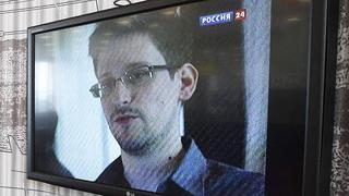 A television screen shows former U.S. spy agency contractor Edward Snowden during a news bulletin at a cafe at Moscow's Sheremetyevo airport June 26, 2013. Russian President Vladimir Putin confirmed on Tuesday a former U.S. spy agency contractor sought by the United States was in the transit area of a Moscow airport but ruled out handing him to Washington, dismissing U.S. criticisms as "ravings and rubbish". REUTERS/Sergei Karpukhin (RUSSIA - Tags: POLITICS SOCIETY TRANSPORT)