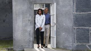 U.S. President Barack Obama and First lady Michelle Obama tour the cell block on Robben Island where Nelson Mandela was held captive near Cape Town, June 30, 2013. Obama visits a bleak former prison island off the coast of South Africa on Sunday to pay tribute to ailing anti-apartheid hero Mandela and set the stage for a speech urging Africans to strive for prosperity and democracy.     REUTERS/Jason Reed     (SOUTH AFRICA - Tags: POLITICS TPX IMAGES OF THE DAY)