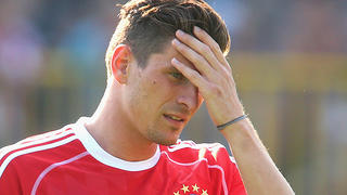 ARCO, ITALY - JULY 04:  Mario Gomez of FC Bayern Muenchen reacts during a training session at Campo Sportivo on July 4, 2013 in Arco, Italy.  (Photo by Alexander Hassenstein/Bongarts/Getty Images)