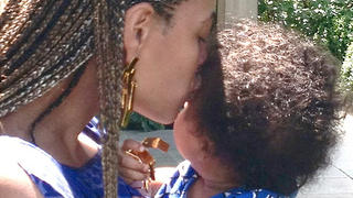 Beyonce shared an intimate moment between her and daughter baby Blue Ivy on her IAmBeyonce Tumblr page recently. In one snap, 11-month-old Blue Ivy can be seen wrapped up in her mother's arms.Another shot shows baby Blue safe in her rapper father's arms, strolling down a path in the black-and-white photo.