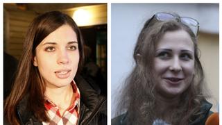 A combination photo shows freed Pussy Riot members Nadezhda Tolokonnikova (L) in Krasnoyarsk and Maria Alyokhina (R) in Nizhny Novgorod speaking to the media after they were released from prison, December 23, 2013.  Two members of Russian punk protest band Pussy Riot were freed from prison on Monday, deriding President Vladimir Putin's amnesty that led to their early release as a propaganda stunt and promising to fight for human rights.   REUTERS/Ilya Naymushin (L)/Sergei Karpukhin (R) (RUSSIA - Tags: POLITICS RELIGION CRIME LAW TPX IMAGES OF THE DAY)