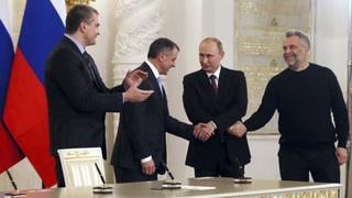 Russian President Vladimir Putin (2nd R), Crimea's Prime Minister Sergei Aksyonov (L), parliamentary speaker Vladimir Konstantinov (2nd L) and Sevastopol Mayor Alexei Chaliy attend a signing ceremony at the Kremlin in Moscow March 18, 2014. Putin and two Crimean leaders signed a treaty on Tuesday on making the Ukrainian Black Sea peninsula a part of Russia. The signing in the Kremlin came two days after Crimeans voted overwhelmingly to secede from Ukraine and join Russia in a referendum condemned by the Ukrainian government, the United States and the European Union as illegitimate. REUTERS/Sergei Ilnitsky/Pool (RUSSIA - Tags: POLITICS)