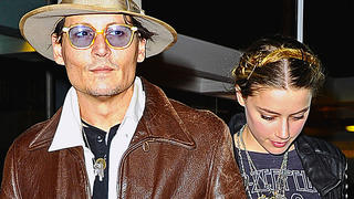 Johnny Depp and fiance Amber Heard were spotted leaving Bauman Rare Books on Madison Avenue in New York City on Tuesday evening. The actor took his wife to be to the store to pick out her favorite books on her birthday. As the two left the store, a fan handed Johnny a rose to give to his lady for her birthday, then upon arriving back at their hotel, the two bumped into Radio man and were all smiles as they chatted with him before making their way back into their hotel.