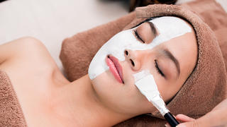 Process of cleansing face with spa mask