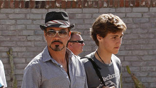 Robert Downey Jr. and his son Indio are see leaving a Memorial Day party in Malibu. Robert was carrying a black case with the Iron Man insignia on it. Generous Robert held a $20 bill in his hand for the valet.<P>Pictured: robert downey jr.<B>Ref: SPL102883  250509  </B><BR/>Picture by: MAP  / Splash News<BR/></P><P><B>Splash News and Pictures</B><BR/>Los Angeles:	310-821-2666<BR/>New York:	212-619-2666<BR/>London:	870-934-2666<BR/>photodesk@splashnews.com<BR/></P>