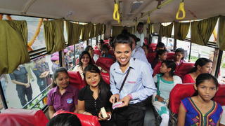 epa04327490 Newly appointed women city bus female conductors give tickets to passengers during the launching of Women City Bus service in Guwahati city, India, 23 July 2014. The Women City Bus service was launched following women harassment in the daily city buses. The lady city bus authorized by the state transport authority will contain women conductor and handyman. During the first phase, male drivers will run the buses to be replace by female drivers later. In a first-of-its-kind move, as many as 12 women have been given martial art training to work on the new bus service. The city bus service for women will operate between 07 am and 11 am and 03 pm to 08 pm every day. The buses will have CCTV cameras and also presence of lady police. Male children below the age of eight years will also be able to ride in such buses, a news report said. EPA/STR +++(c) dpa - Bildfunk+++