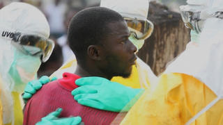 Health workers surround an Ebola patient who escaped from quarantine from Monrovia's Elwa hospital, in the centre of Paynesville in this still image taken from a September 1, 2014 video. When the starving Ebola patient escaped from the treatment centre in Monrovia and staggered through a crowded market in search of food, bystanders who scattered in his path voiced their anger not at him but at Liberia's president. To many in this impoverished West African country, President Ellen Johnson Sirleaf's government has not done enough to protect them from the deadly virus. Ebola has killed more than 1,000 people in Liberia since its arrival six months ago. Across West Africa, the death toll from the world's worst Ebola outbreak has surpassed 1,900.  REUTERS/Reuters TV/Files (LIBERIA - Tags: HEALTH DISASTER POLITICS)