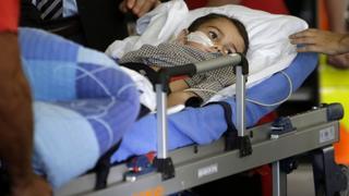 Ashya King, a 5-year-old British boy with a brain tumour, lies on a stretcher as he arrives with his parents at Motol hospital in in Prague  September 8, 2014. The British boy with a brain tumour, whose parents, Brett and Naghemeh King were briefly arrested in Spain when seeking alternative care, will receive treatment in Prague, a Czech clinic said on Monday.     REUTERS/David W Cerny (CZECH REPUBLIC - Tags: HEALTH)